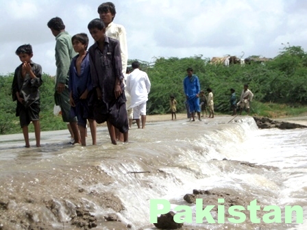 flooded road in Pakistan, humans starve, no drinking water, no food
